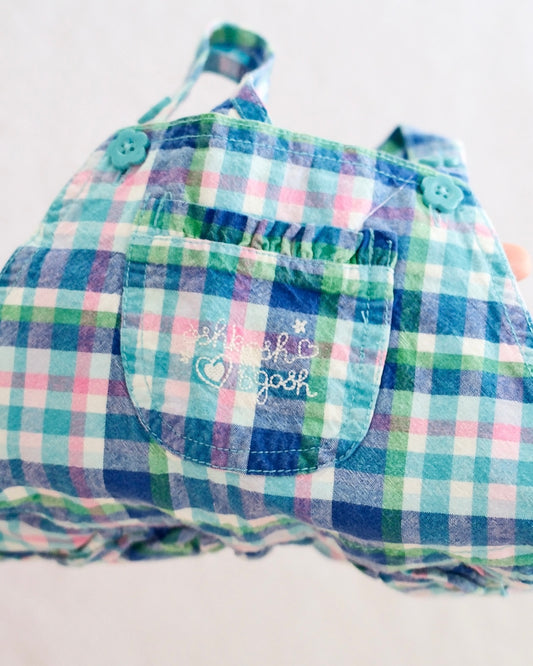 Y2K OshKosh B'Gosh girls blue plaid bubble shortall size 24 months, front flat lay, madras plaid in blue green pink and white, teal flower buttons