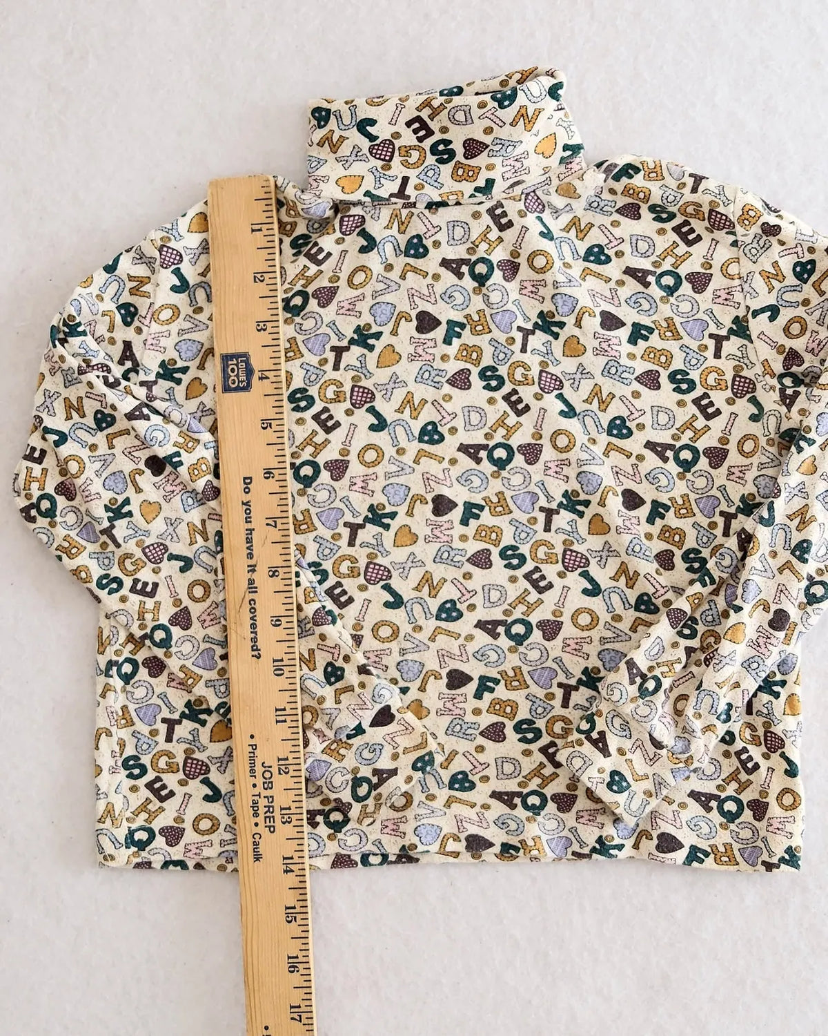 Vintage Corner Stone cream alphabet heart print turtleneck