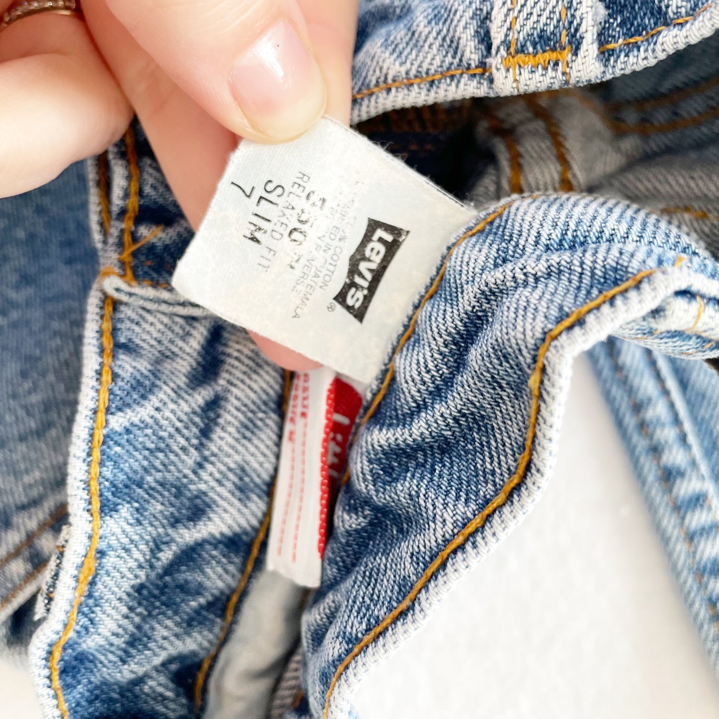 Levi’s Medium Wash 550 Orange Tab Jeans • 7 slim