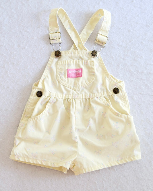Vintage OshKosh B'Gosh girls butter yellow floral shortall keyhole back, scattered ditsy pink and blue floral print,  pink OshKosh patch