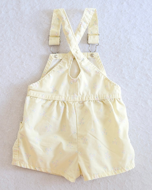 Vintage OshKosh B'Gosh girls butter yellow floral shortall keyhole back, scattered ditsy pink and blue floral print,  pink OshKosh patch