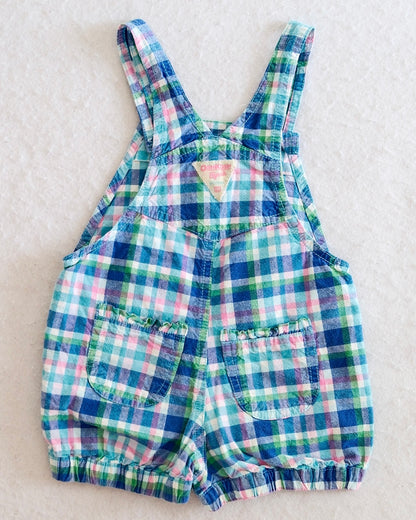 Y2K OshKosh B'Gosh girls blue plaid bubble shortall size 24 months, front flat lay, madras plaid in blue green pink and white, teal flower buttons