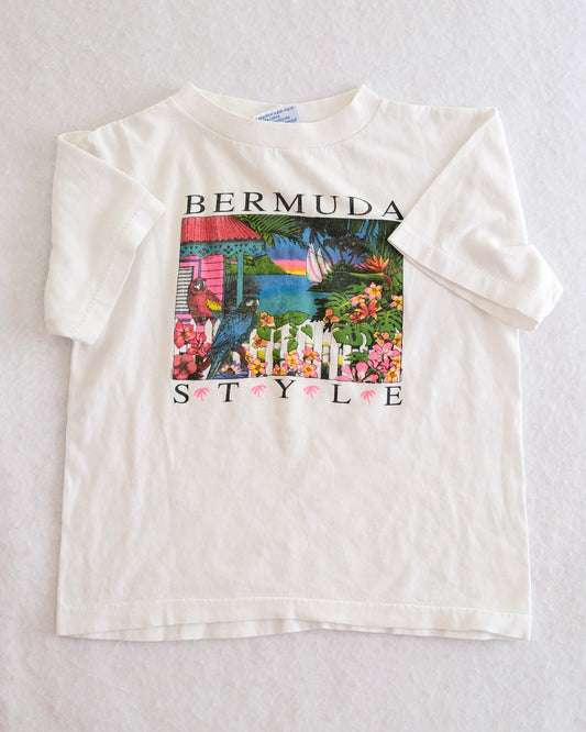 White t-shirt with a colorful graphic and 'Bermuda Style' text on a light gray background